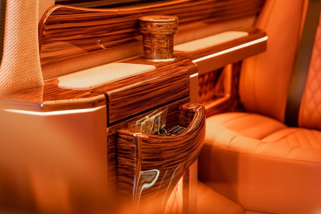 Elegant close-up of luxury wooden seating design in warm tones.